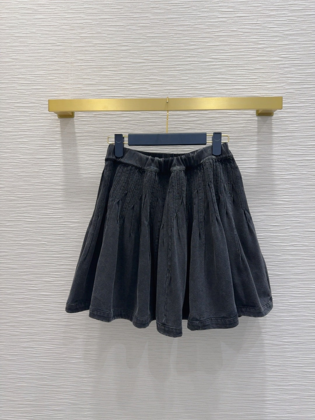 Mini Pleated Skirt with Logo Tag Detail