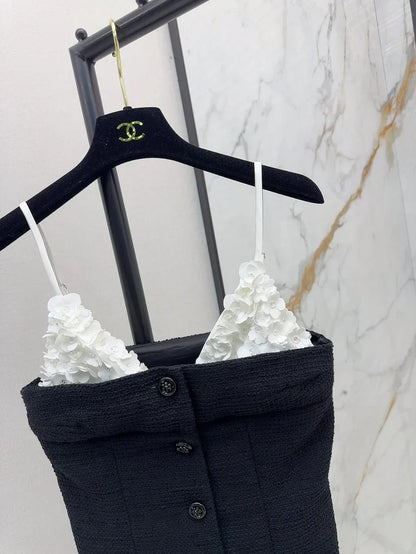 White floral top with black suspenders Vest