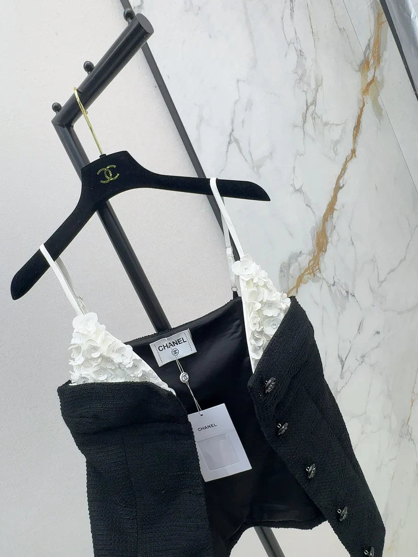 White floral top with black suspenders Vest