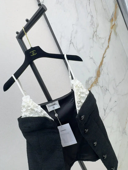 White floral top with black suspenders Vest