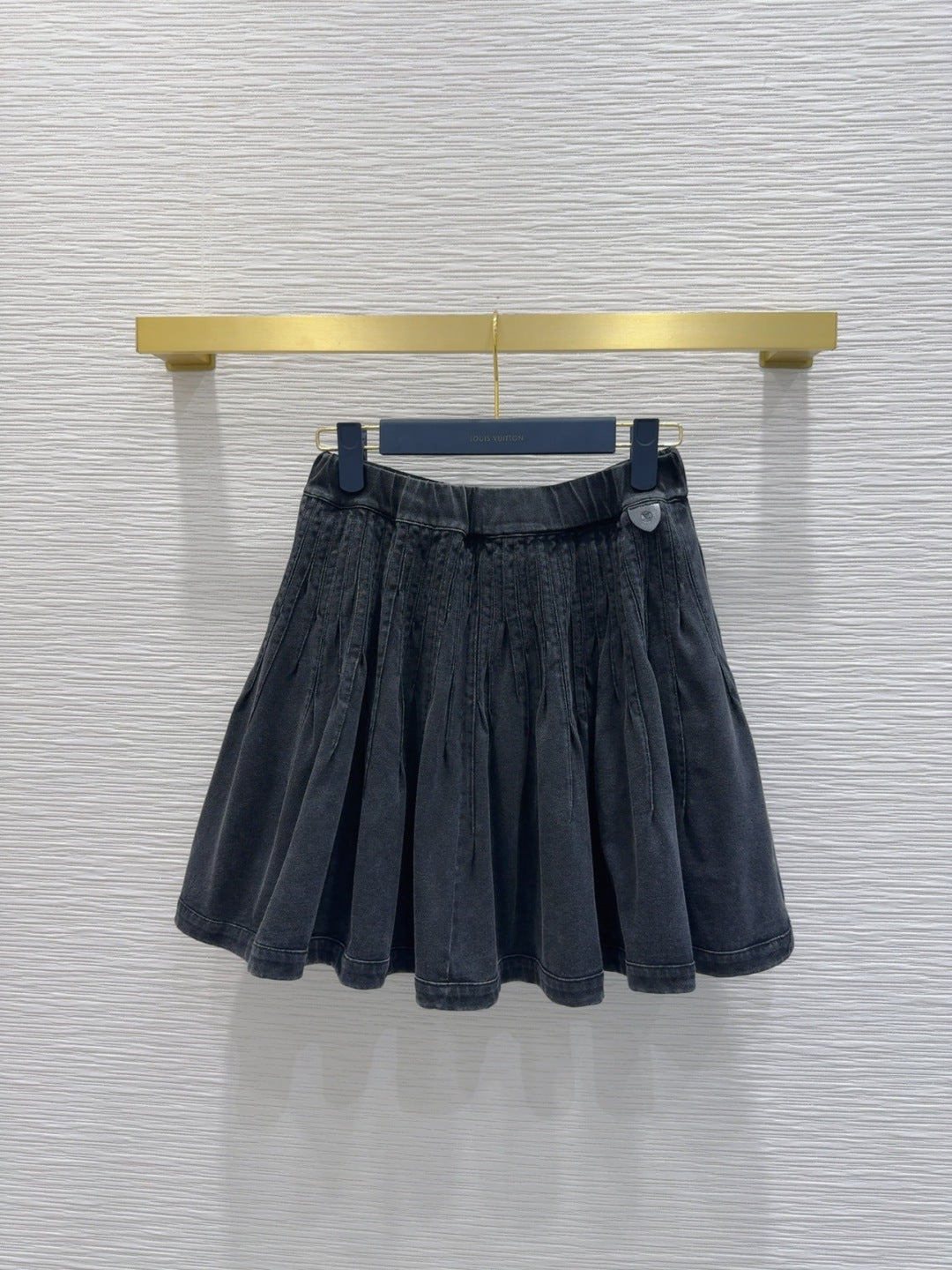 Mini Pleated Skirt with Logo Tag Detail