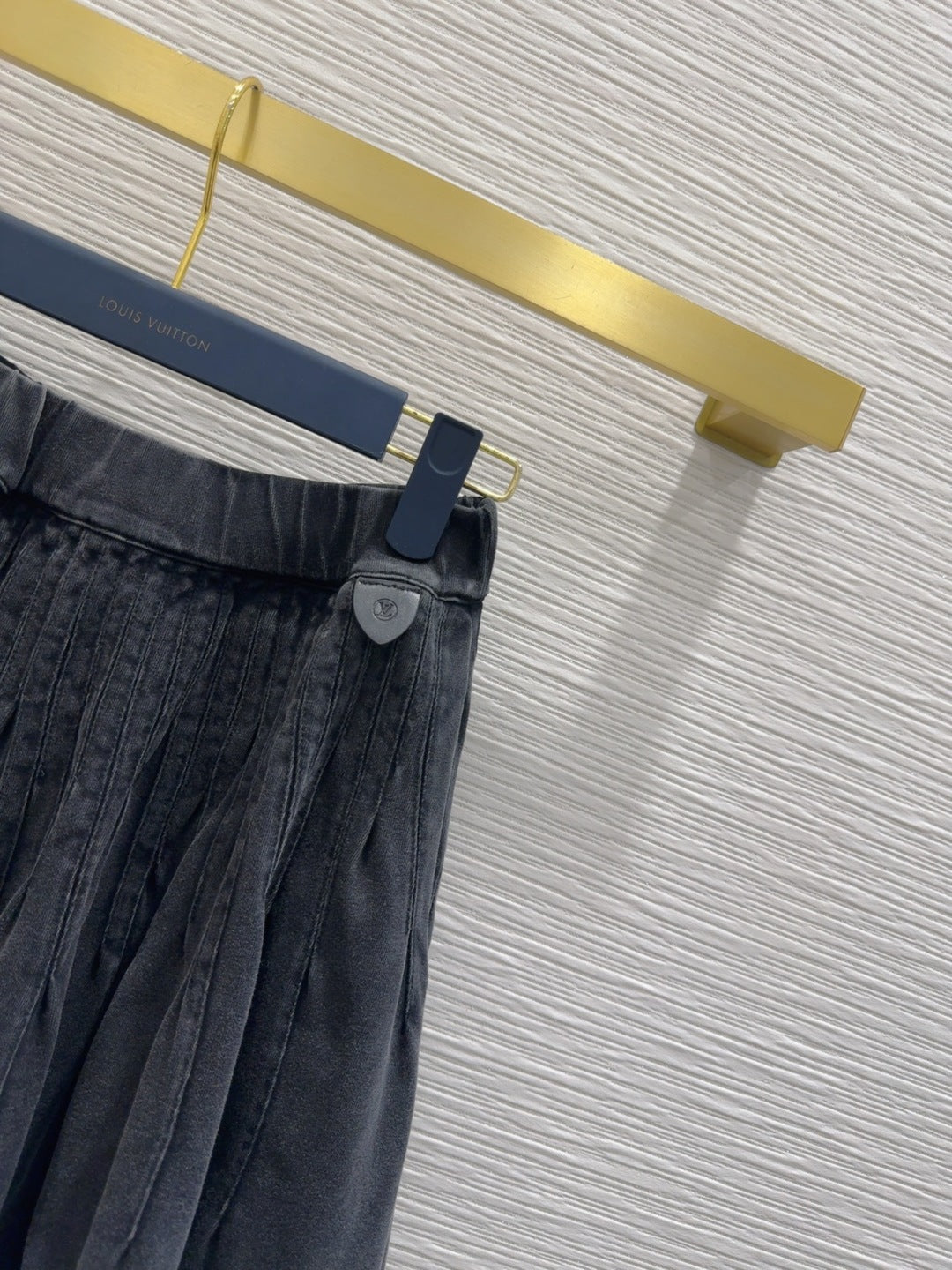 Mini Pleated Skirt with Logo Tag Detail